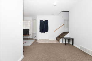 Interior space with light colored carpet