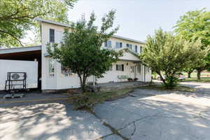 View of front of property with a carport