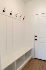 Mudroom featuring wood-type flooring