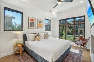 Bedroom featuring ceiling fan and light hardwood / wood-style floors