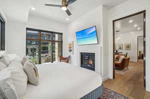 Bedroom featuring wood-type flooring and ceiling fan