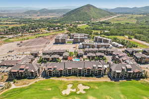 Birds eye view of property with a mountain view