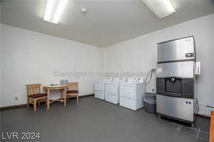 Washroom featuring tile patterned floors and washer and dryer