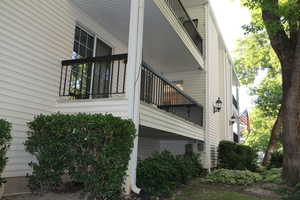 View of  outside landscaping and unit E deck