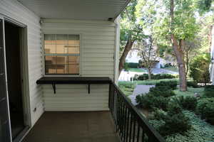 View to North sidewalk, visitor parking and kitchen window