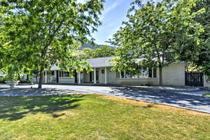 View of front of property featuring a front lawn