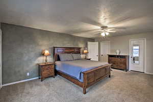 Bedroom featuring light colored carpet and ceiling fan