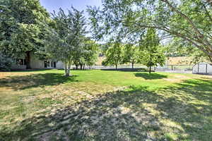 View of yard featuring a storage shed