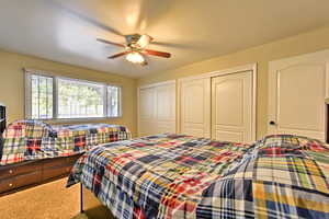 Bedroom featuring carpet floors and ceiling fan