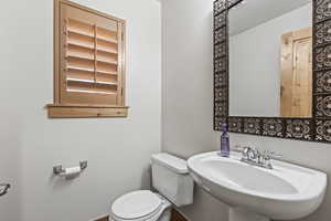 Bathroom featuring sink and toilet