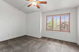 Empty room with carpet and ceiling fan