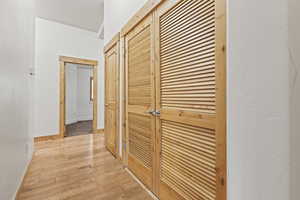 Corridor featuring light hardwood / wood-style floors