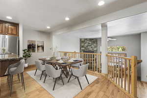 Dining space featuring ceiling fan and light hardwood / wood-style floors