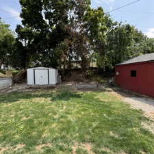 View of yard featuring a storage shed