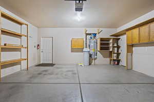 Garage with a garage door opener and water heater