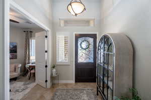 Entrance foyer featuring light tile patterned floors