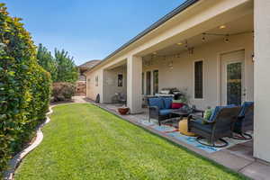 View of yard with an outdoor hangout area and a patio area