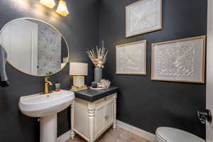 Bathroom with tile patterned floors and toilet