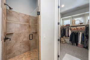 Bathroom with a shower with shower door