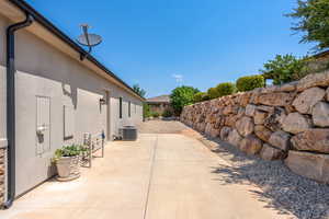 View of patio featuring central AC unit