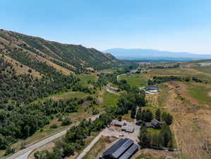 Birds eye view of property with a mountain view