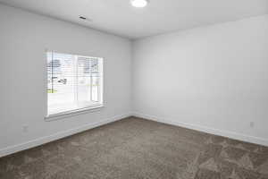 Empty room with carpet flooring