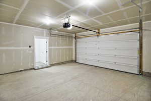 Garage featuring a garage door opener