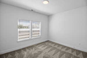 Unfurnished room featuring carpet flooring