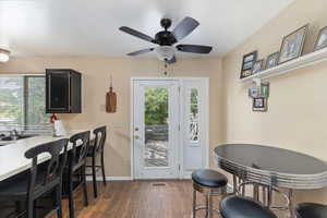 Dining room with hardwood / wood-style flooring, and ceiling fan