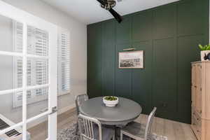 Dining space with light wood-type flooring and ceiling fan