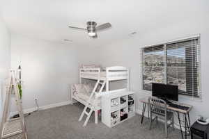 Bedroom featuring carpet and ceiling fan