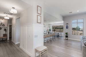 Hall with light hardwood / wood-style flooring