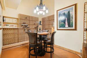 Wine area featuring an inviting chandelier