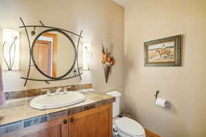 Bathroom with vanity and toilet