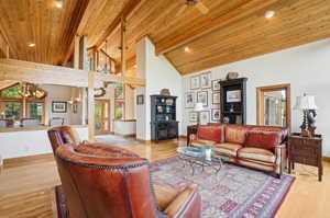 Living room with light hardwood / wood-style floors and a healthy amount of sunlight