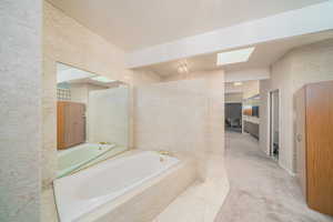 Bathroom with a relaxing tiled tub