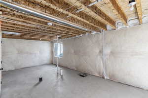 Unfinished basement with the option to add another bedroom, bathroom, and media room.