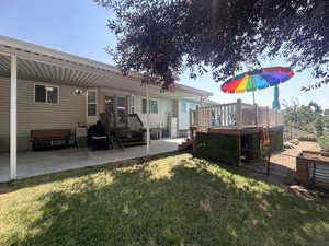 rear view/covered patio/pool deck