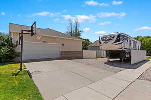 View of side of property featuring a lawn