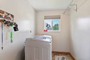 Clothes washing area featuring independent washer and dryer