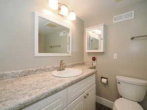 Bathroom with toilet and vanity