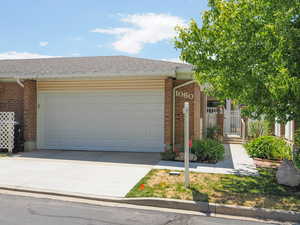 View of front of property featuring a garage