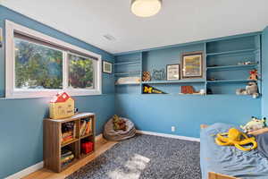 Recreation room featuring light wood-type flooring