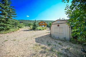 View of yard featuring a storage shed