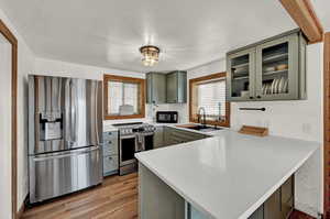 Kitchen featuring sink, a healthy amount of sunlight, kitchen peninsula, and stainless steel appliances