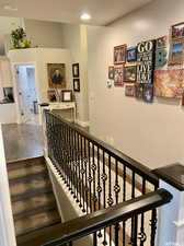 Stairway featuring wood-type flooring