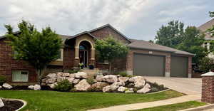 View of front facade with a garage and a front yard