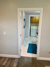 Bathroom featuring washer and dryer and tile patterned floors