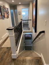 Staircase featuring dark hardwood / wood-style floors