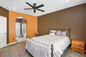 Bedroom featuring light tile patterned floors and ceiling fan